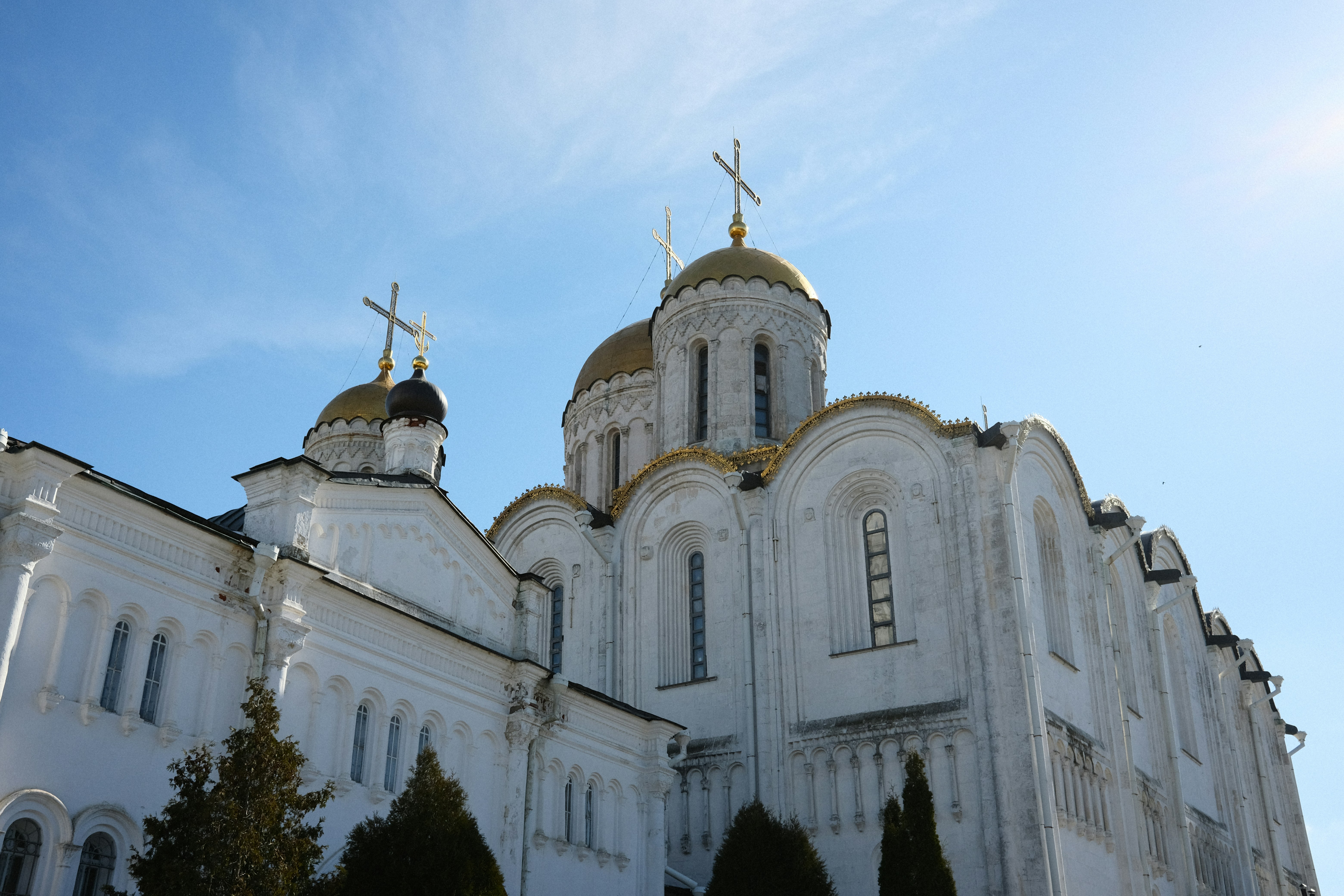 a large white building with two crosses on top of it