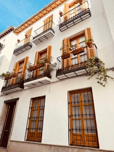a tall white building with lots of windows