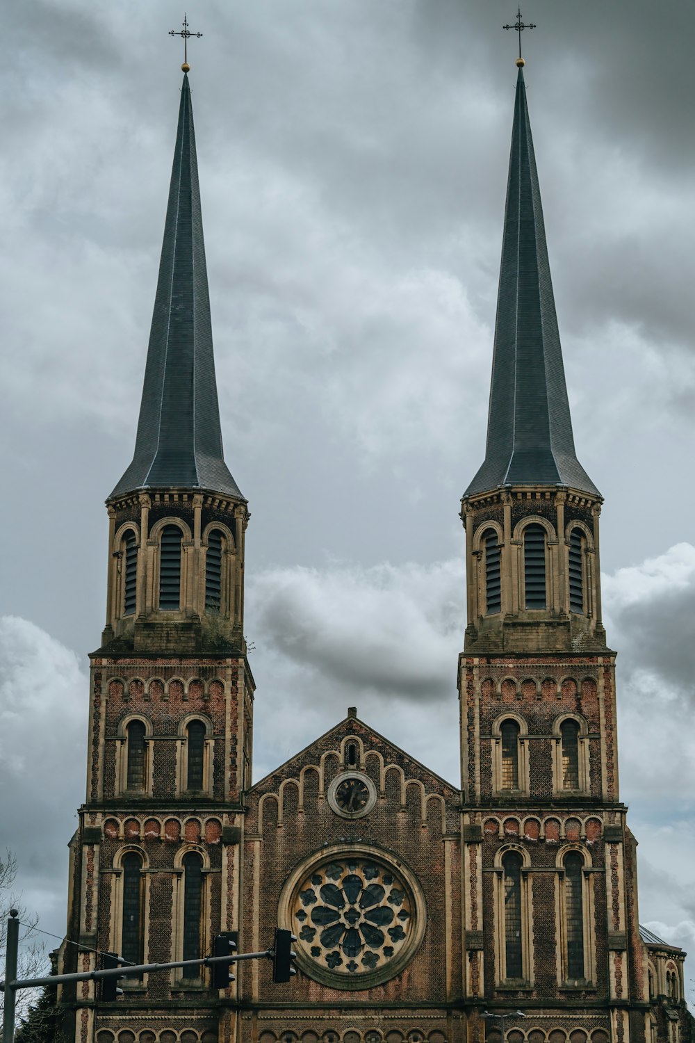 an old church with two steeples and a clock