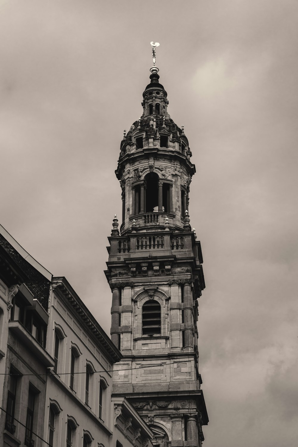 a black and white photo of a clock tower