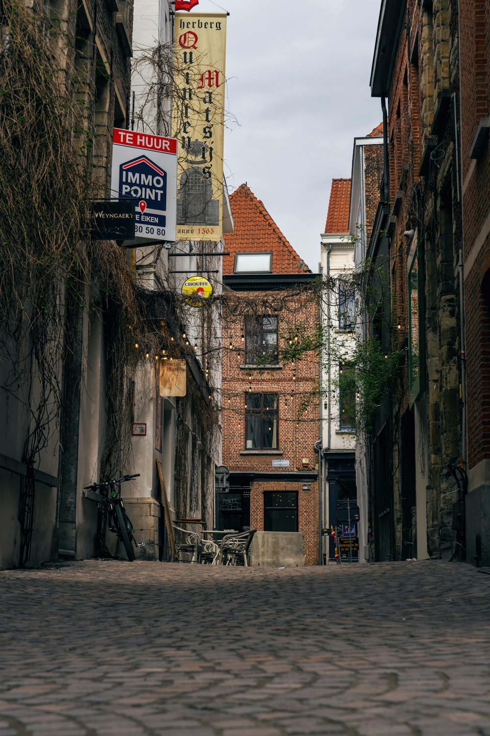 a cobblestone street in an old european city