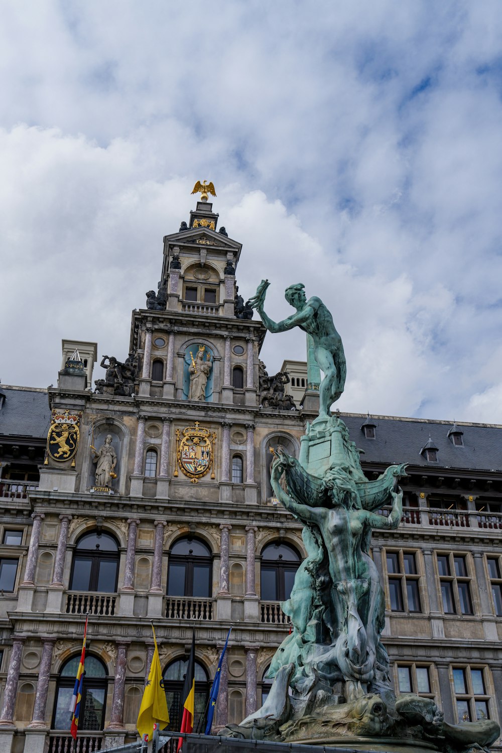 a statue of a man on a horse in front of a building