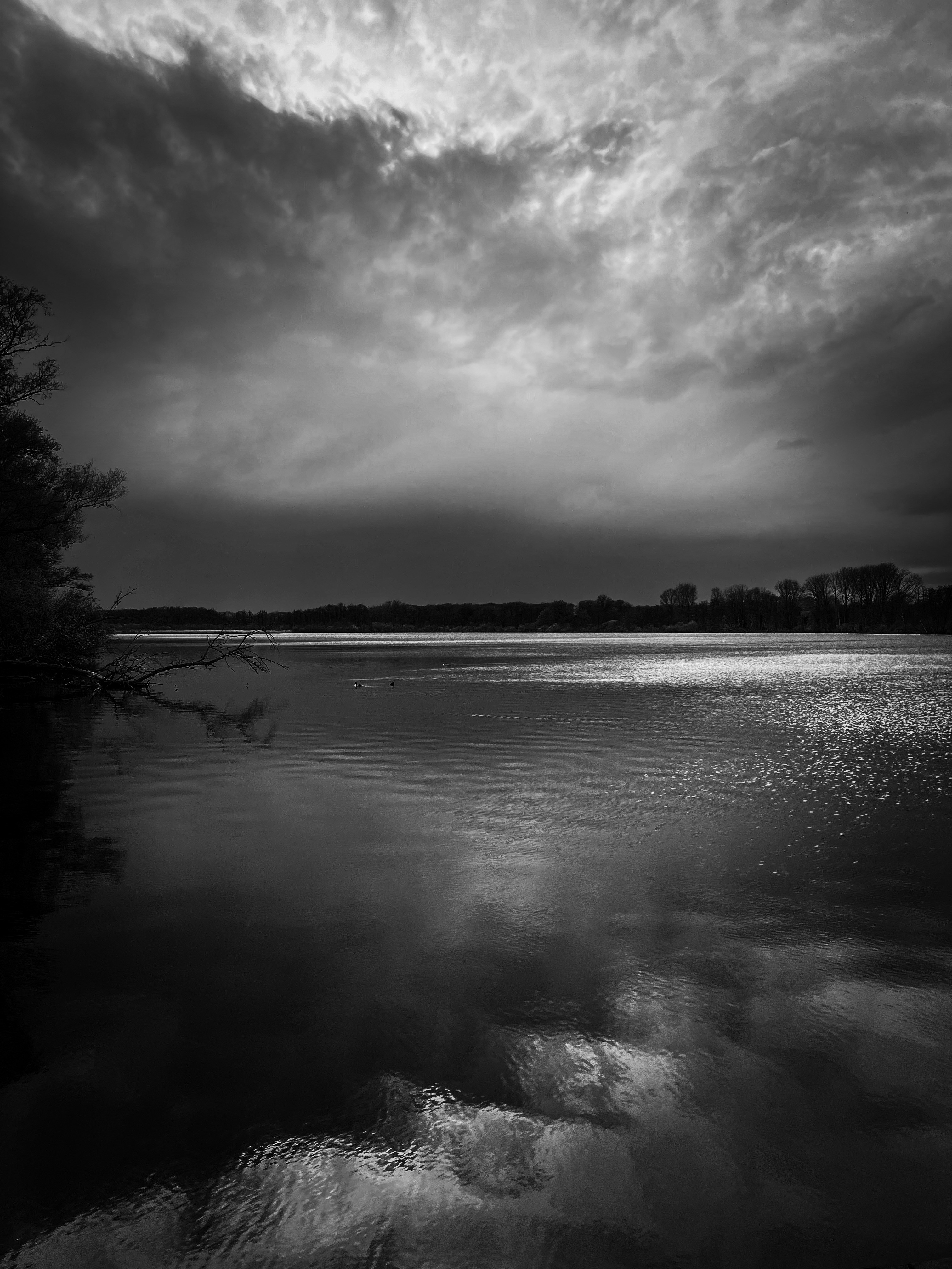Serene lake reflection with dramatic sky, tranquil fantasy environment