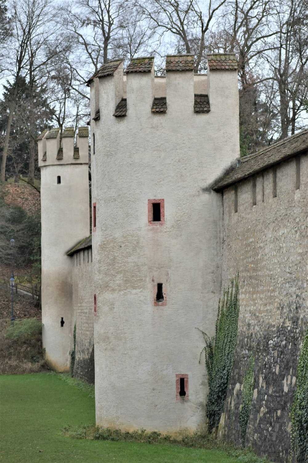an old castle with a clock on the side of it