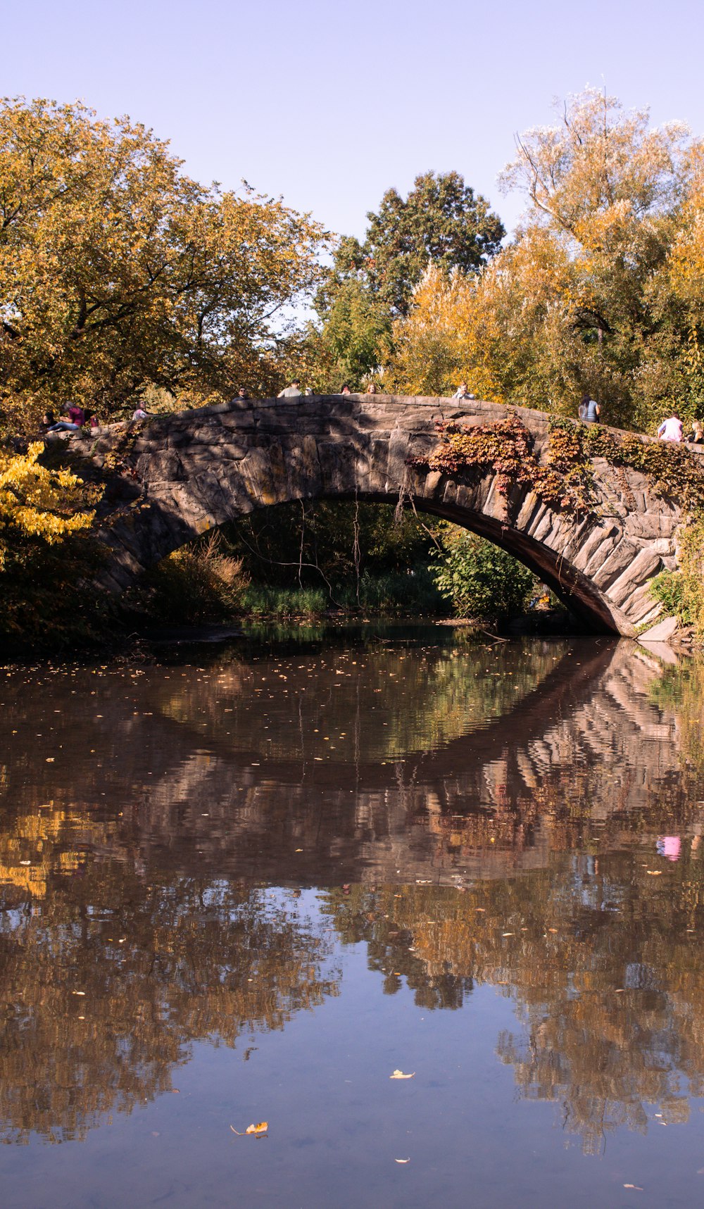 a stone bridge over a body of water