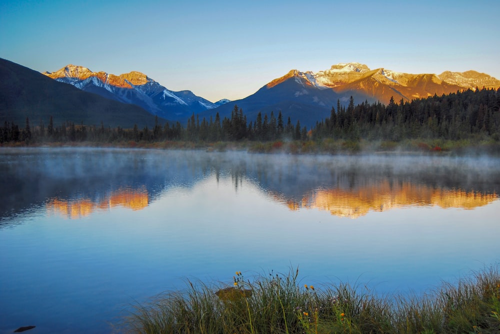 a lake with mountains in the background