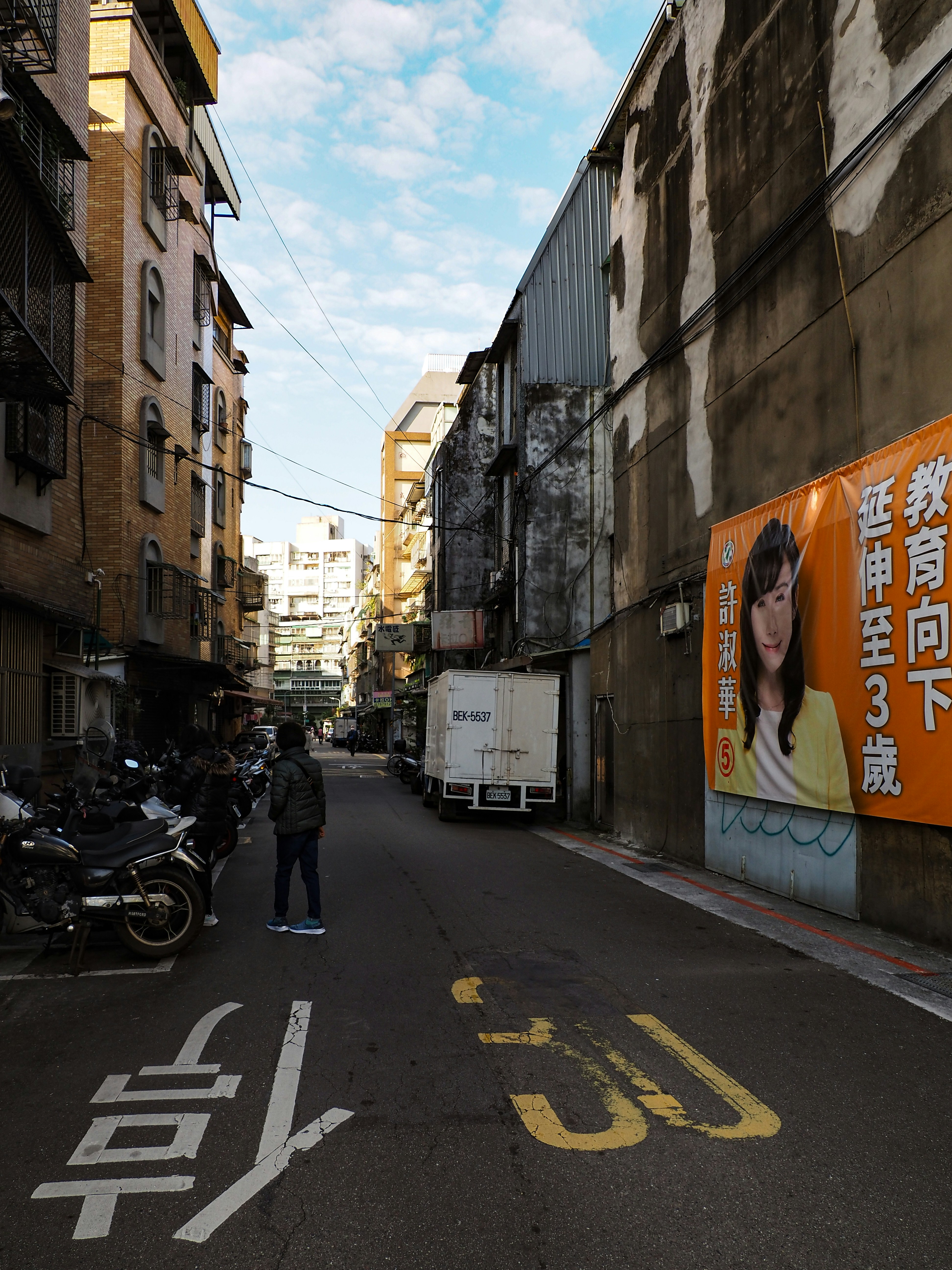 a man standing in the middle of a street