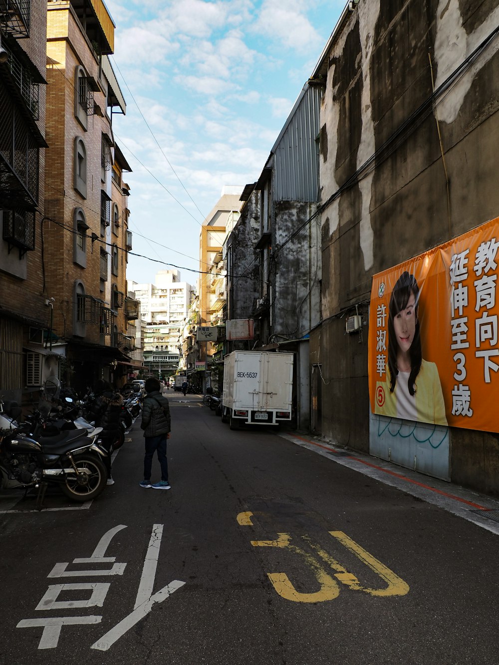 a man standing in the middle of a street