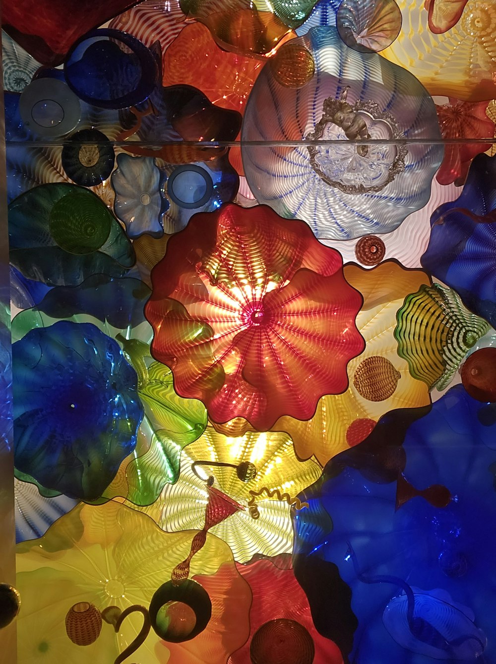 a close up of a multi colored glass sculpture