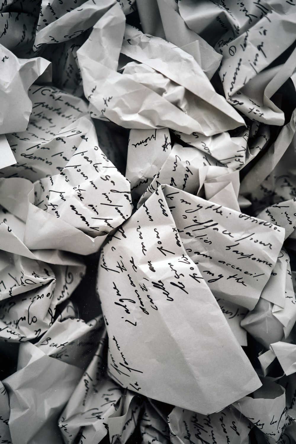 a pile of paper with writing on it