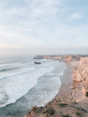 a view of the ocean from the top of a cliff