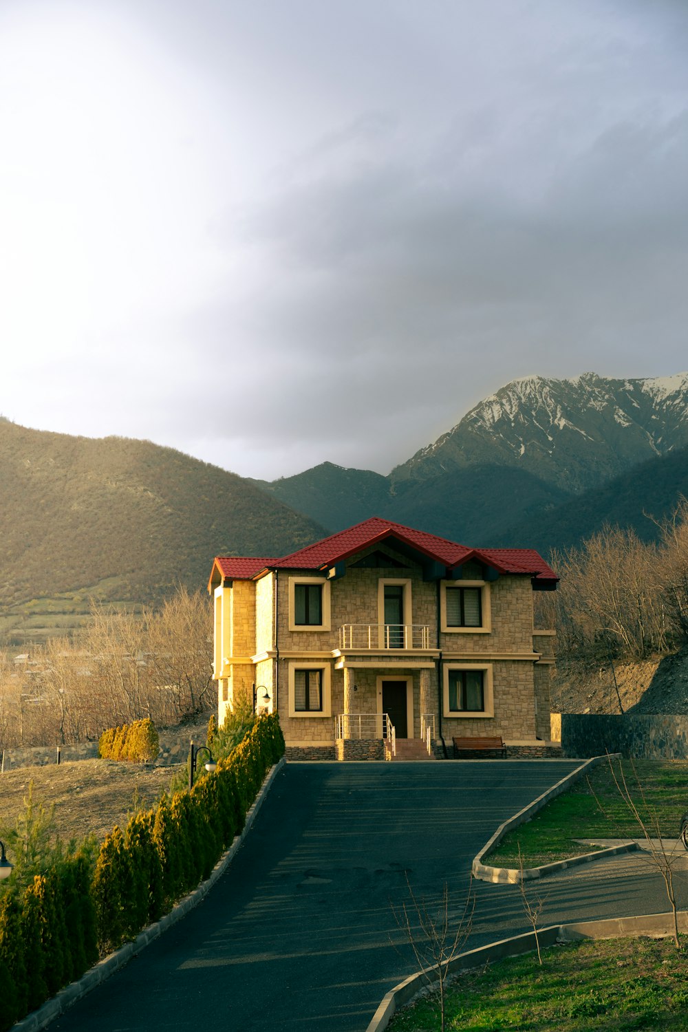 a large house sitting on the side of a road