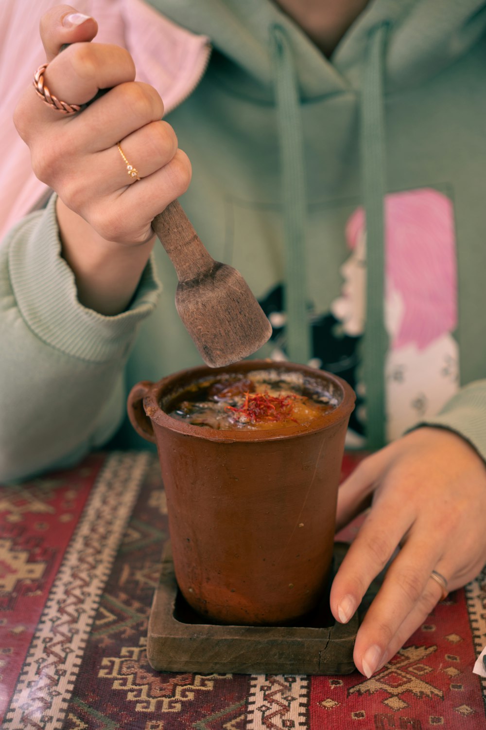 a person with a knife in a cup