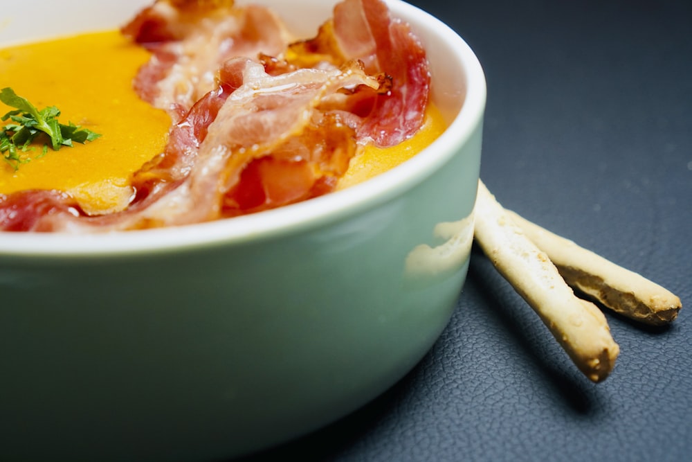 a close up of a bowl of food on a table