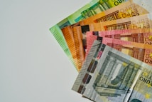a pile of mexican currency sitting on top of each other