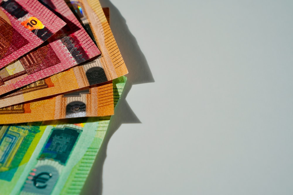 a pile of money sitting on top of a table