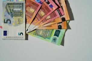 a bunch of money sitting on top of each other