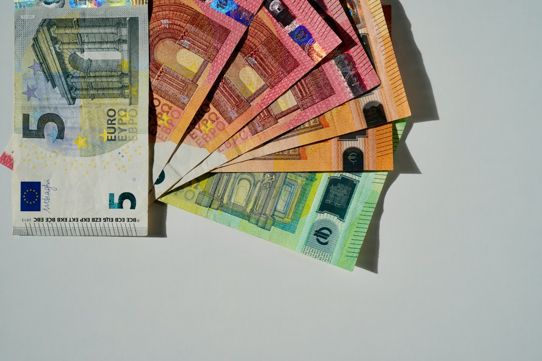 a bunch of money sitting on top of each other,