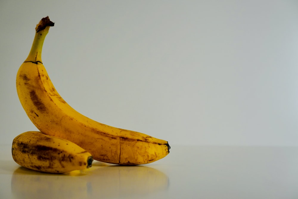 a couple of bananas sitting on top of a table