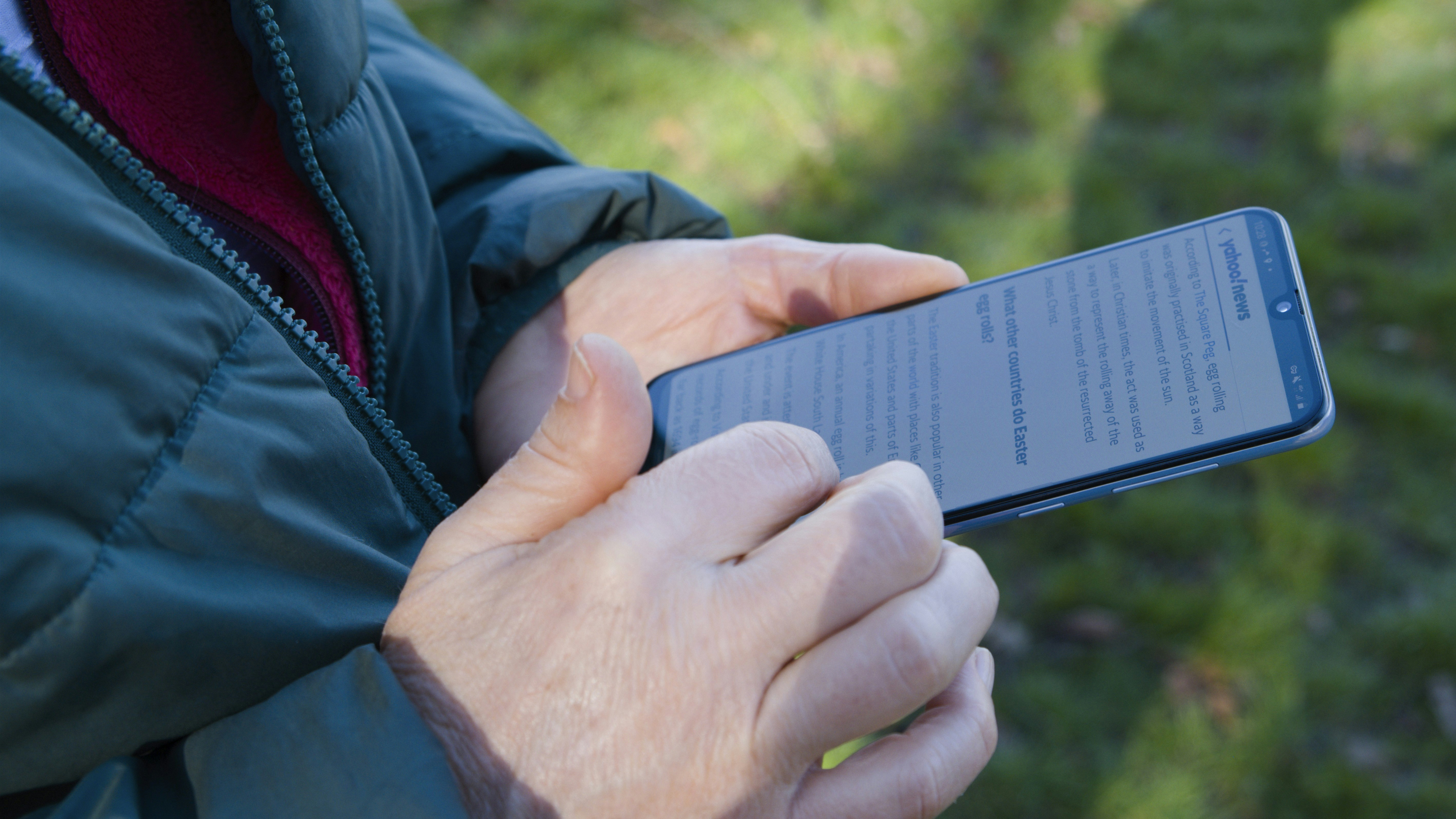 a close up of a person holding a cell phone