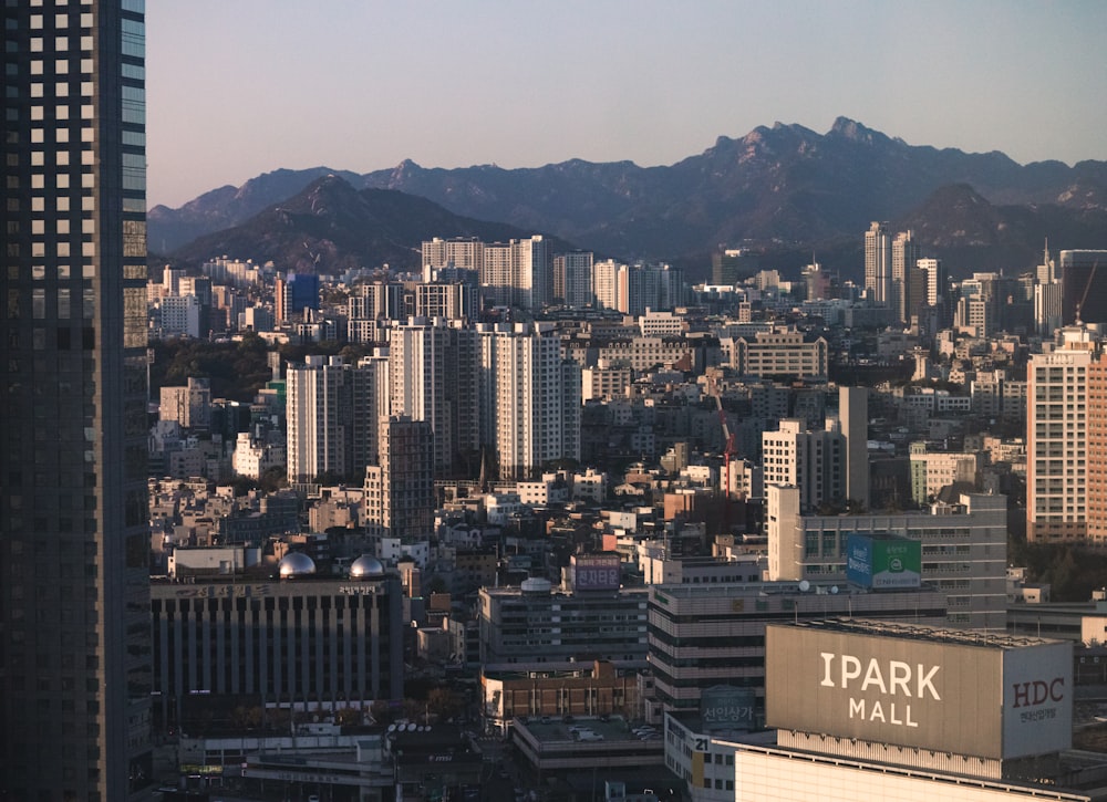 a view of a city with mountains in the background