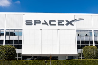 a building with a sign that says spacex on it
