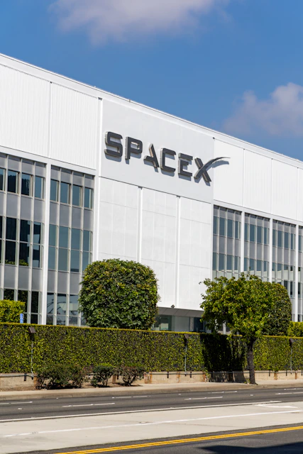 SpaceX building that has a spacex sign on the side of it