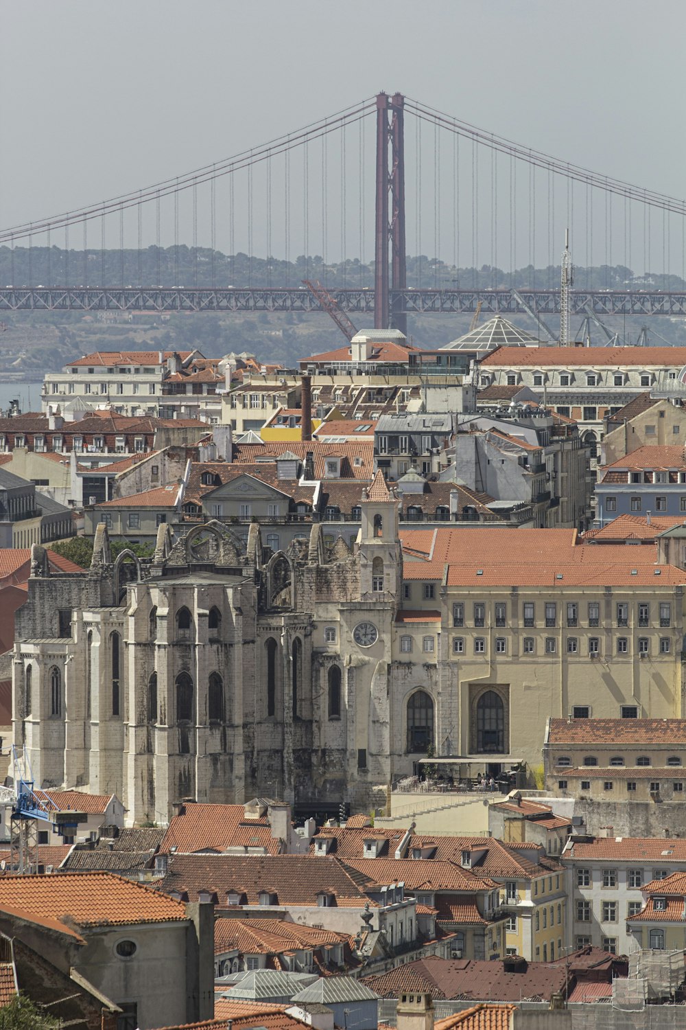 a view of a city with a bridge in the background