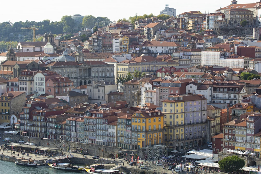 a group of buildings next to a body of water