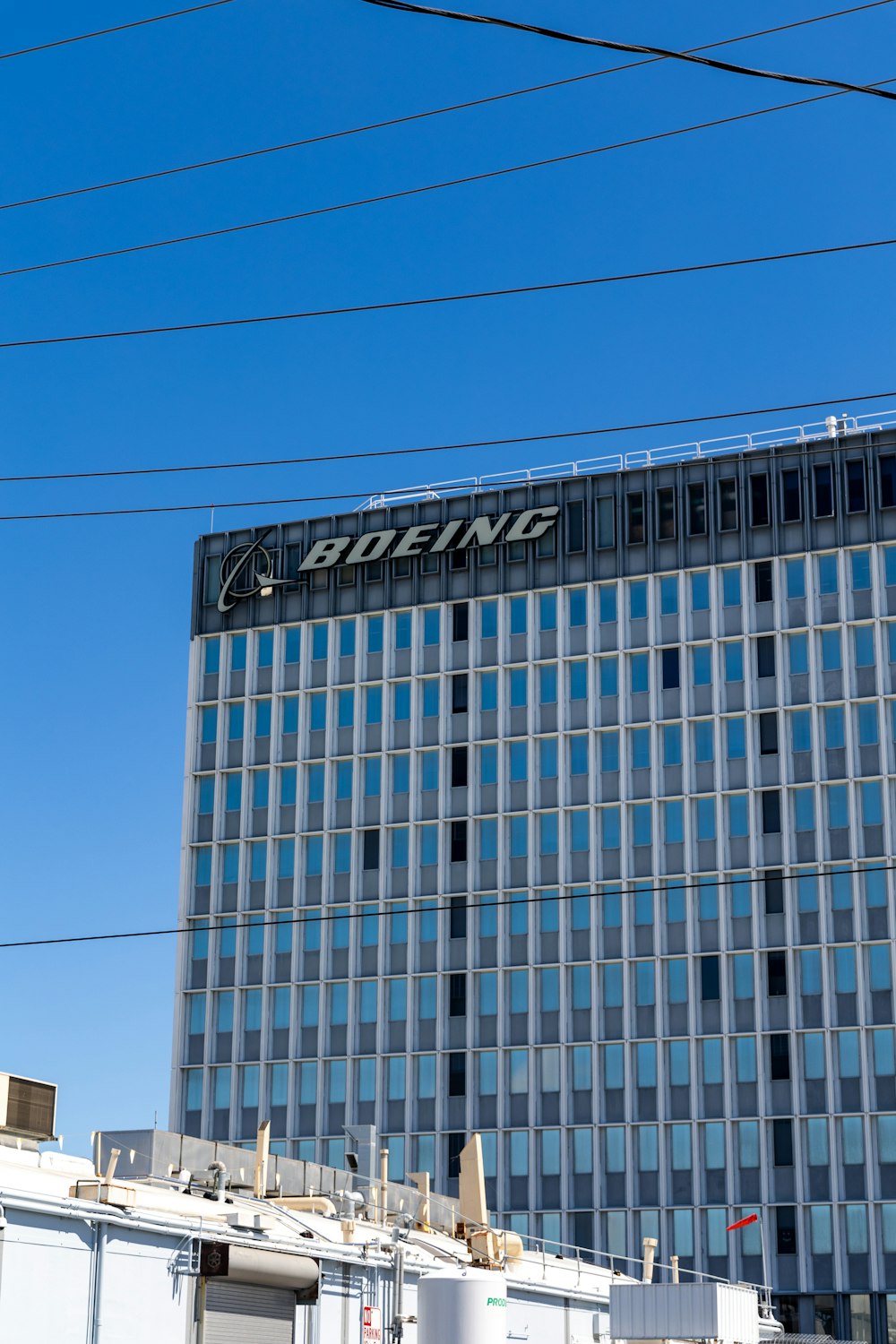 a tall building with a sign on top of it