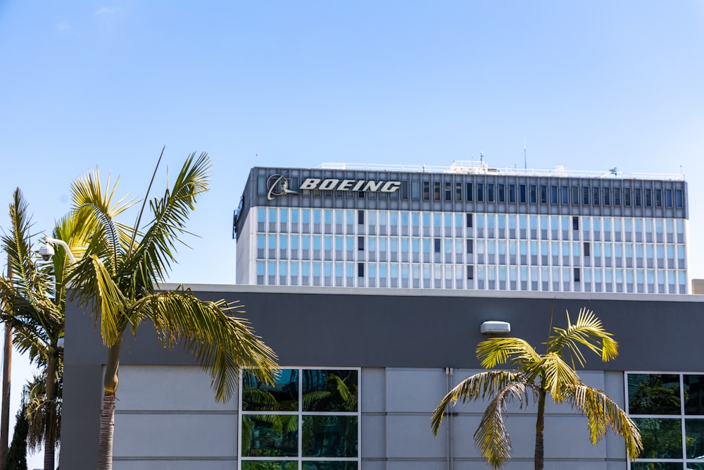 a building with palm trees in front of it