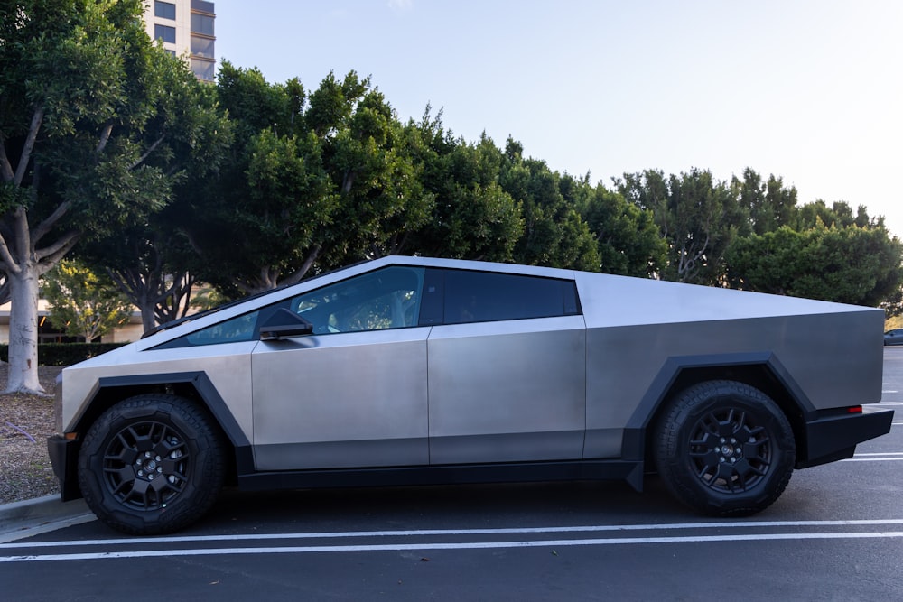 a futuristic car is parked in a parking lot