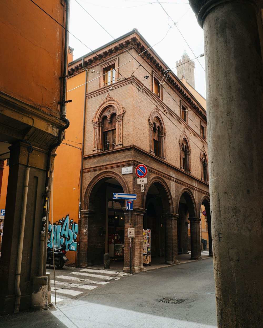 an old building with graffiti on the side of it