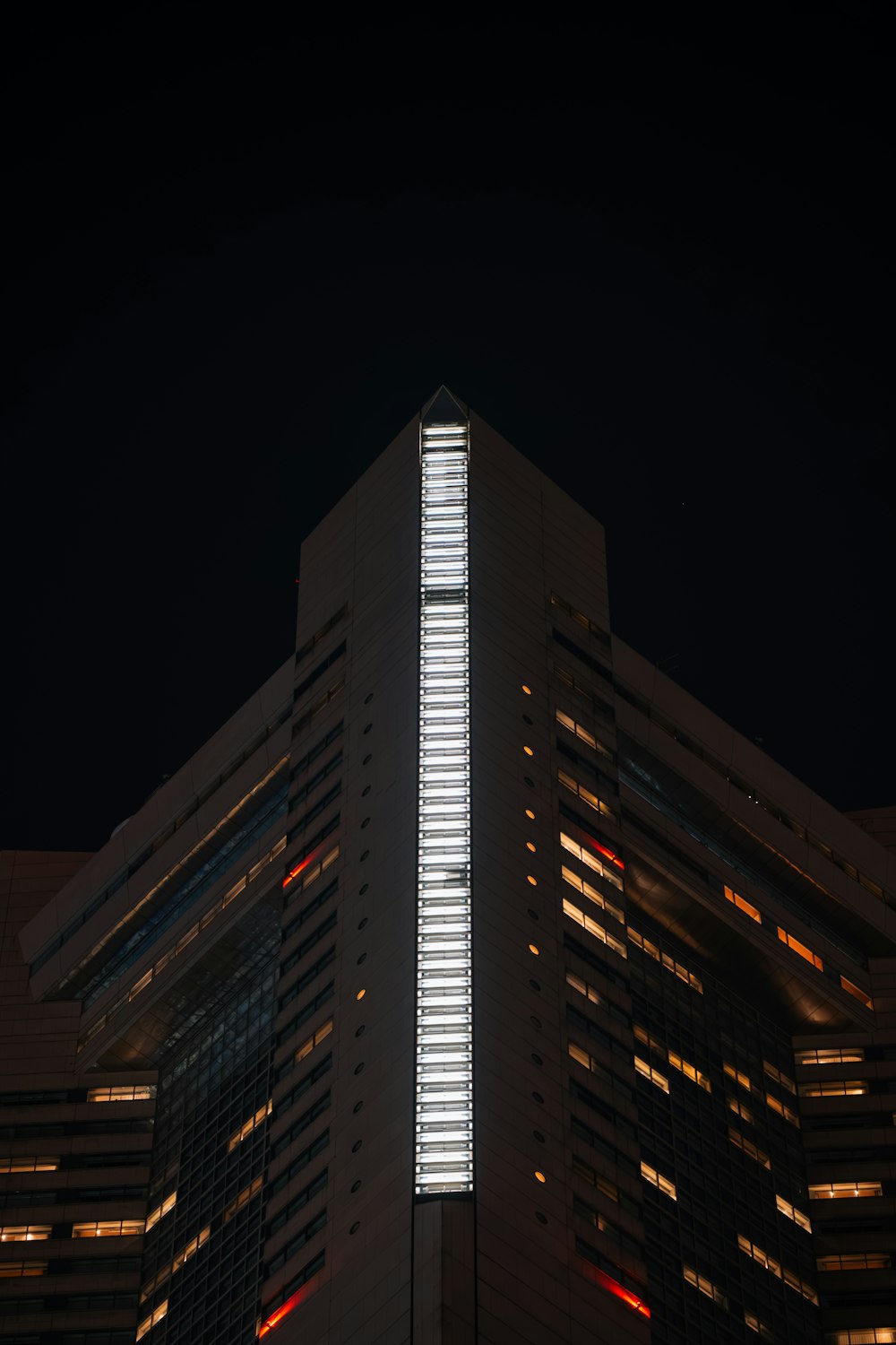 a very tall building lit up at night