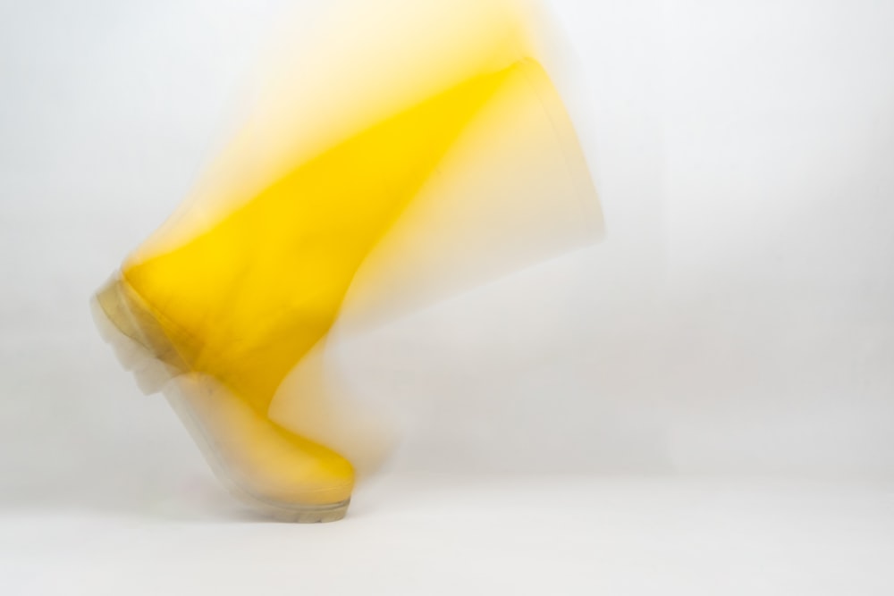 a blurry photo of a banana on a white background