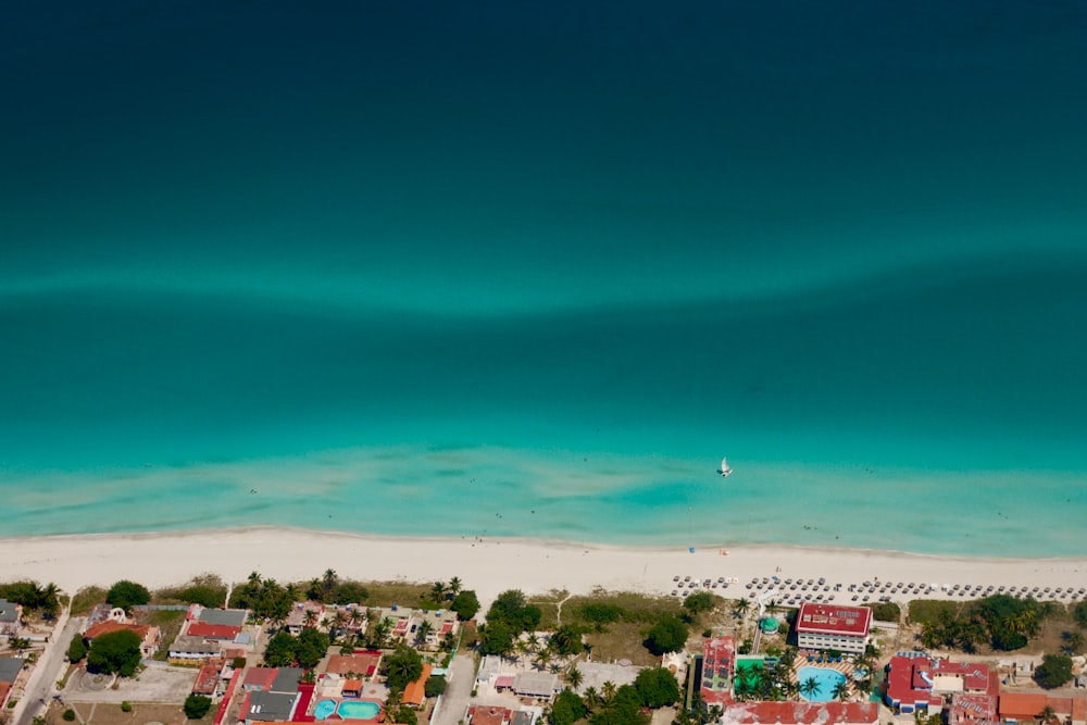 a bird's eye view of a beach and a city