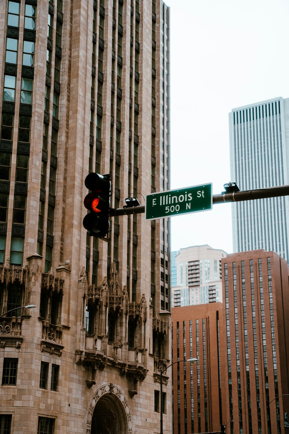 a traffic light in front of a tall building