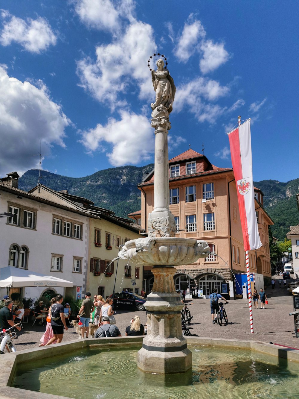 a fountain in the middle of a town square