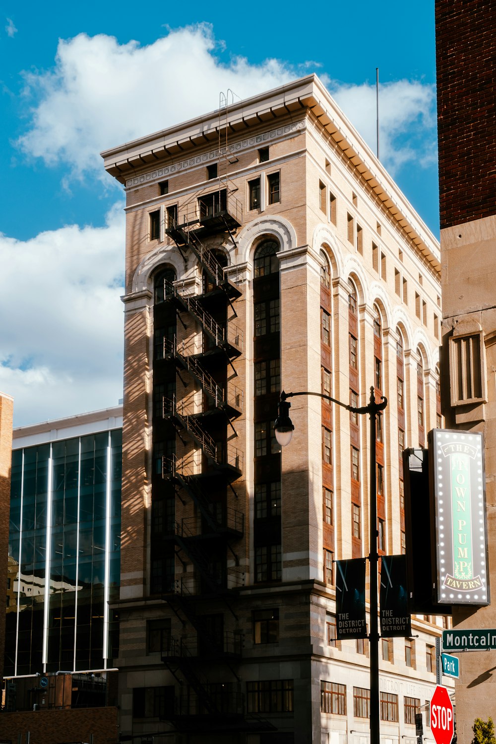 a tall brick building sitting next to a traffic light