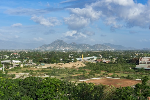 a view of a city with mountains in the background