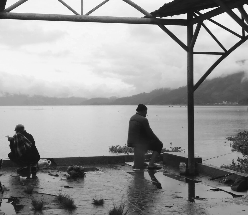 a couple of people that are standing in the water