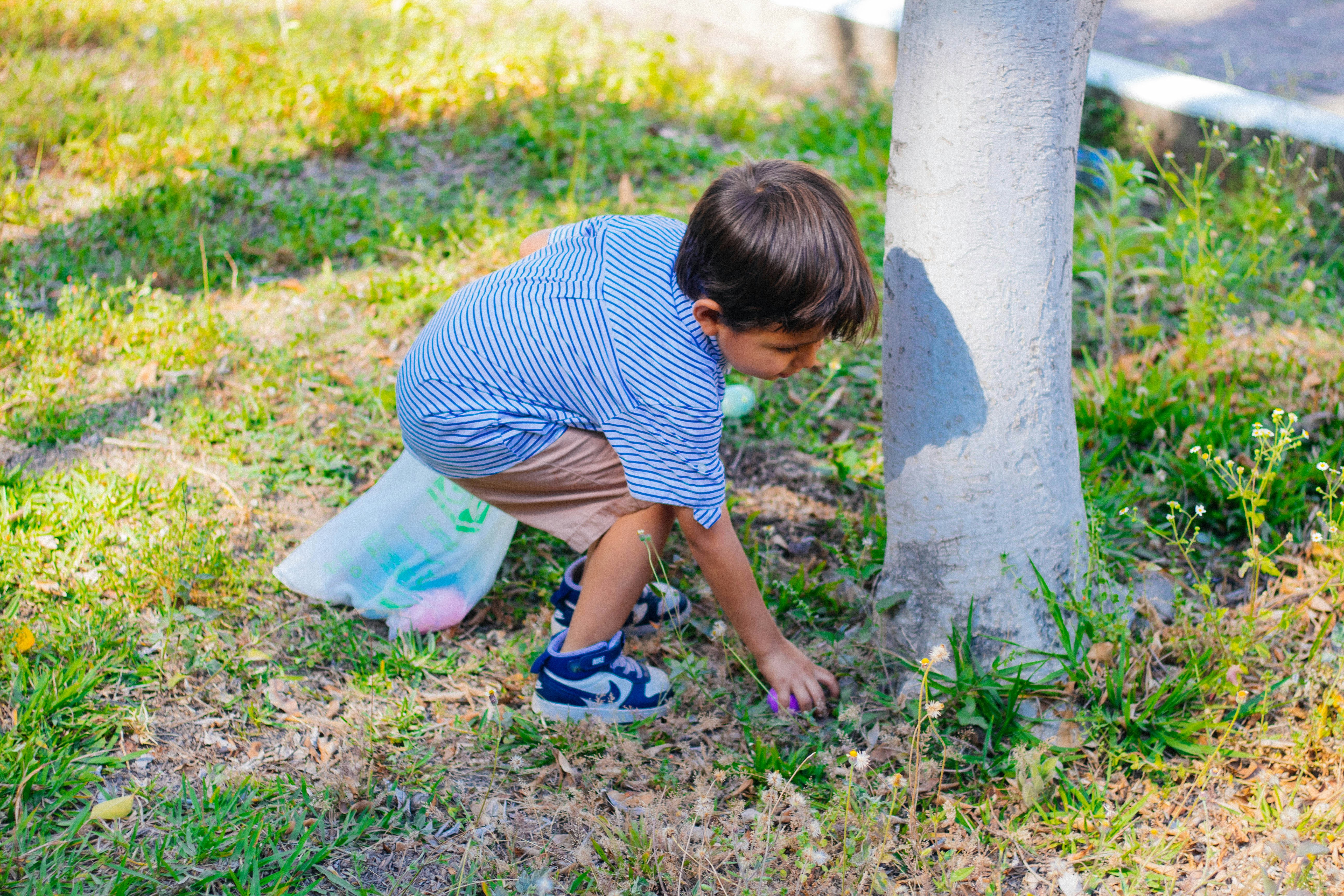 child doing a nature-based activity like gardening or walking outdoors - Holistic child therapy