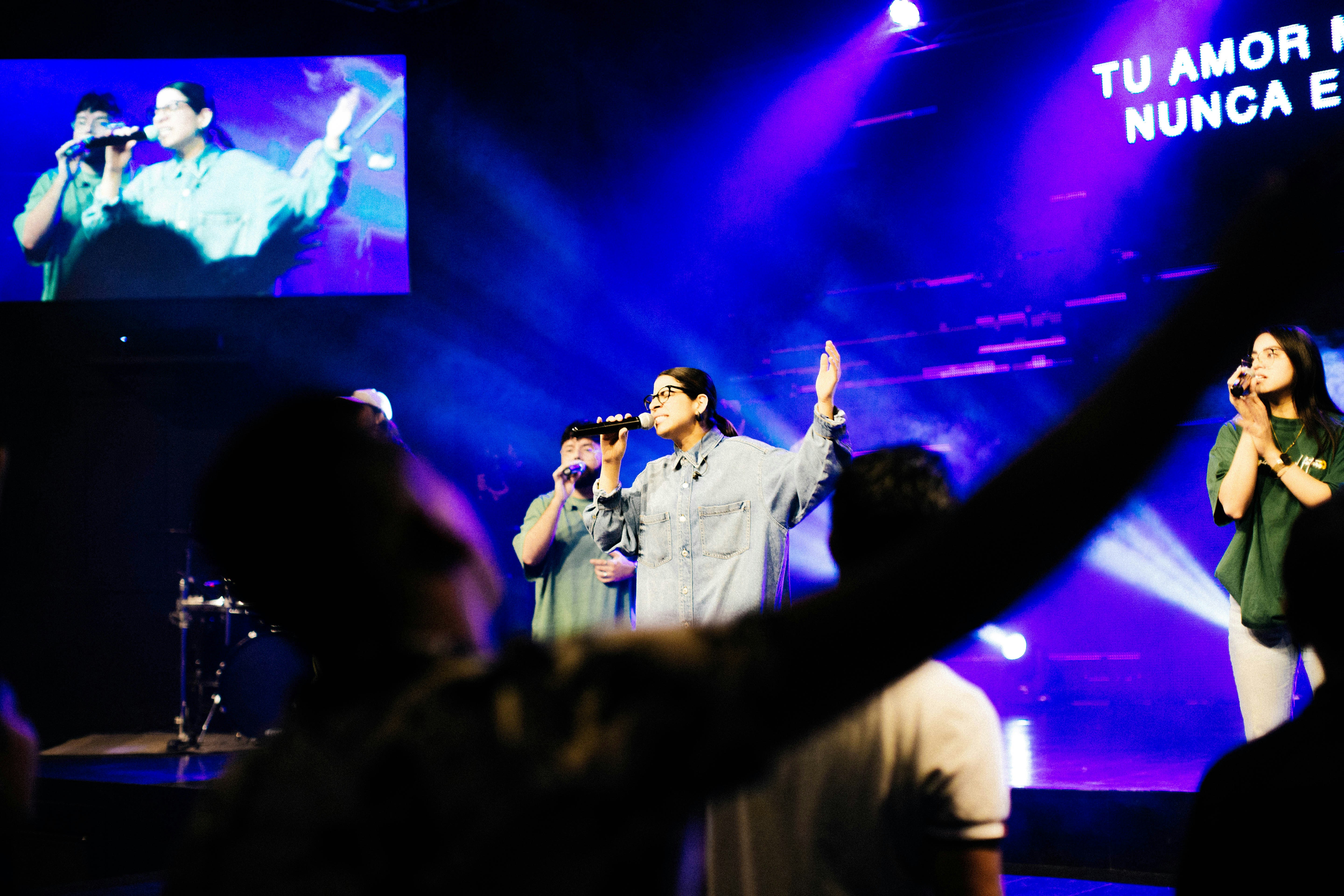 a group of people standing on top of a stage