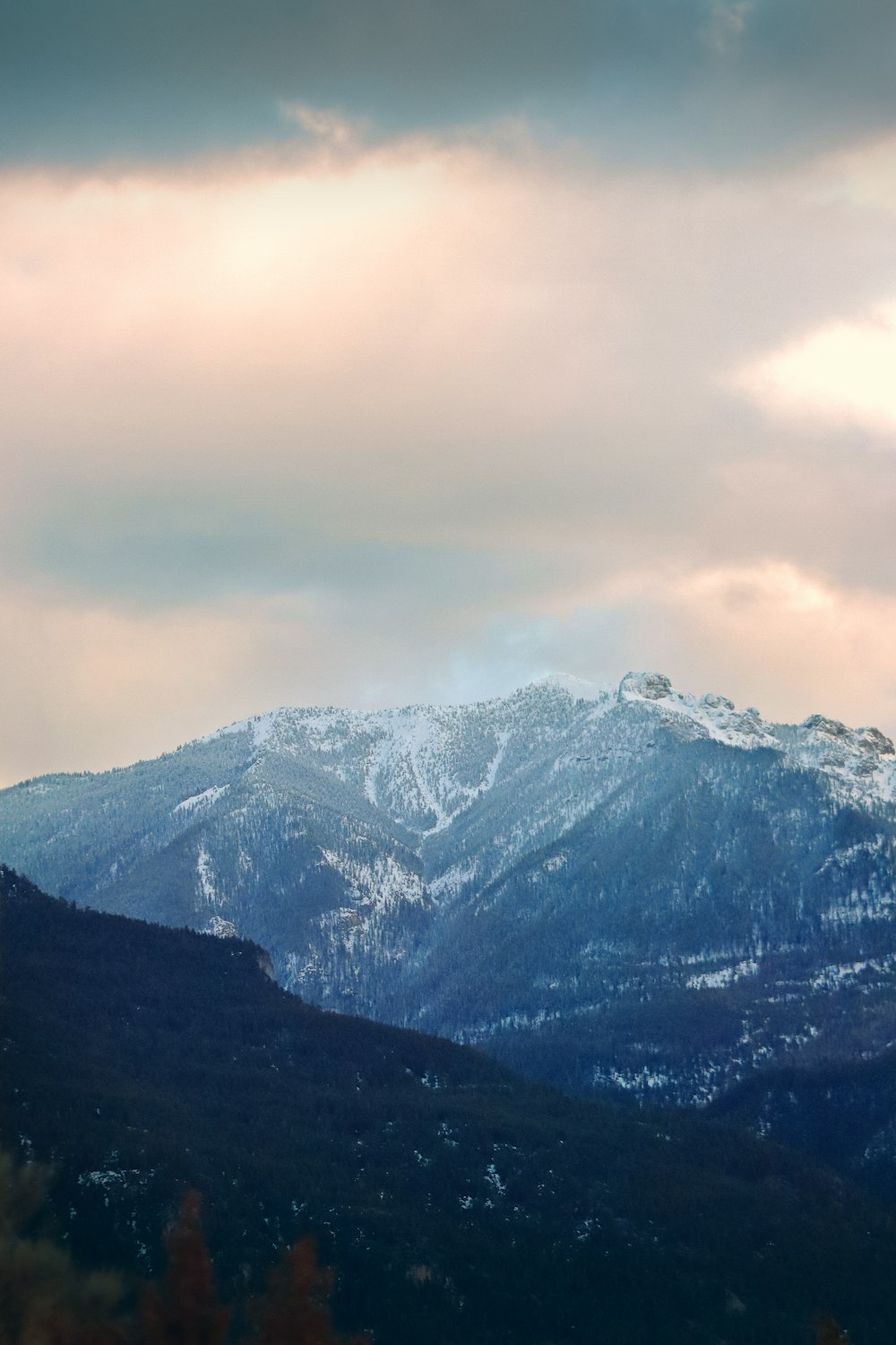 a view of a mountain range with a cloudy sky