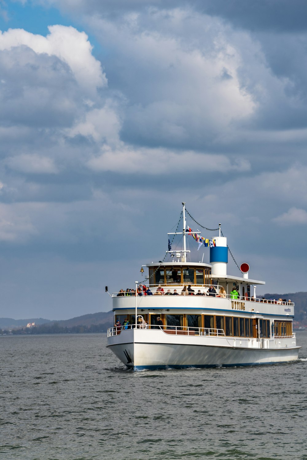 a large white boat floating on top of a large body of water