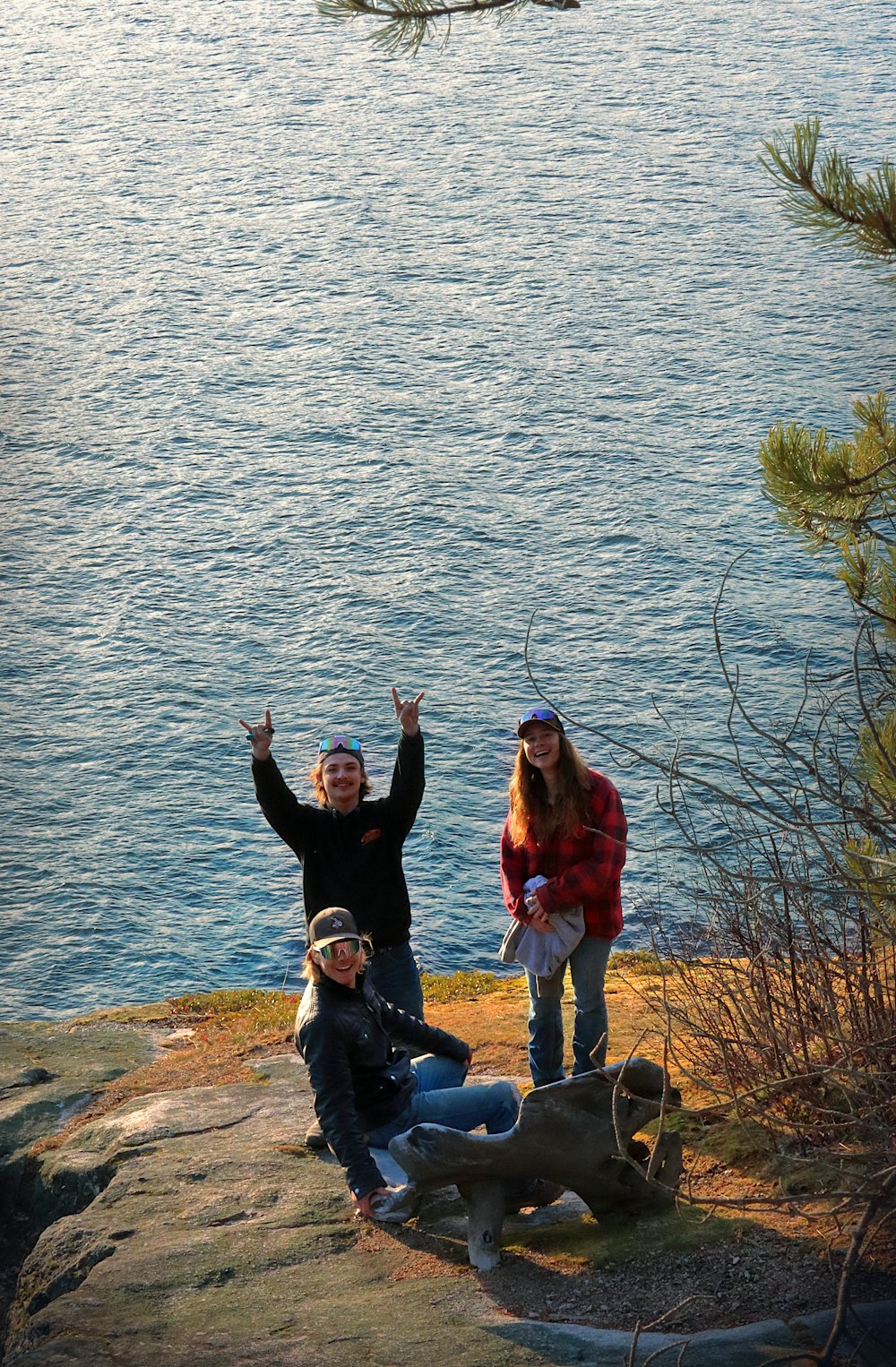 a couple of people that are sitting on some rocks