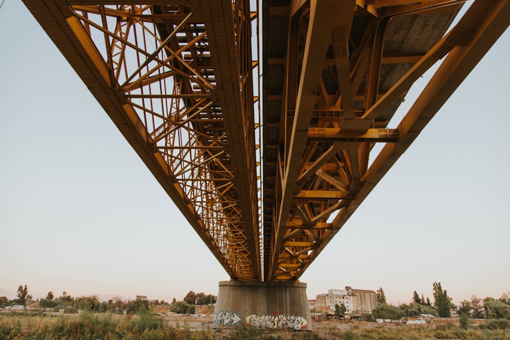 the underside of a bridge with graffiti on it