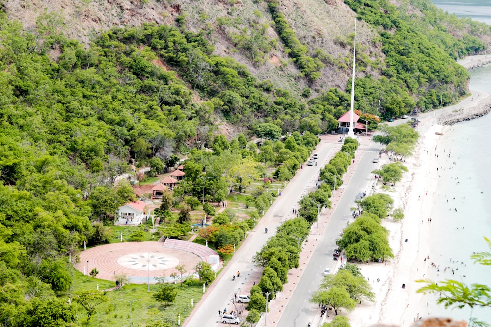 an aerial view of a beach with a clock tower