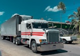 a large semi truck driving down a street