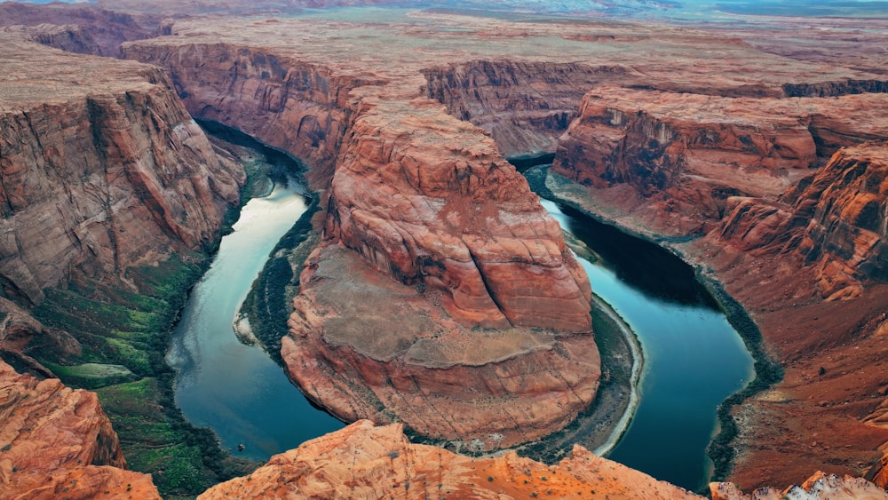 a river running through a canyon surrounded by mountains